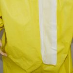 Disposable chemical coverall with zipper and placket
