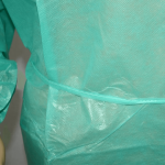 disposable isolation gown ties on the waist